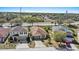 An aerial view of a well-maintained home with a driveway, landscaping, and a location near a highway at 217 Sand Ridge Dr, Davenport, FL 33896