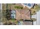 Aerial view shows the layout of a house with a pool, roof details, yard, and surroundings for context at 217 Sand Ridge Dr, Davenport, FL 33896