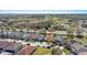 An aerial view captures a neighborhood with a home near a serene pond at 217 Sand Ridge Dr, Davenport, FL 33896