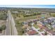 An aerial view features a developed area alongside a well-trafficked highway, showcasing its location and infrastructure at 217 Sand Ridge Dr, Davenport, FL 33896