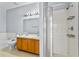 Bathroom features a double vanity, soaking tub, and a glass-enclosed shower at 217 Sand Ridge Dr, Davenport, FL 33896