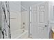 Clean bathroom includes a shower with tub at 217 Sand Ridge Dr, Davenport, FL 33896