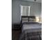 Serene bedroom with a comfortable bed, wood furniture, and soft lighting, creating a peaceful and relaxing retreat at 217 Sand Ridge Dr, Davenport, FL 33896