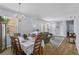 A spacious dining room connects to the living room with lots of natural light and comfortable seating at 217 Sand Ridge Dr, Davenport, FL 33896
