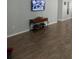 Hallway features tile flooring and console table with decor, leading to various parts of the home with stylish simplicity at 217 Sand Ridge Dr, Davenport, FL 33896