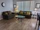 Comfortable living room featuring tile floors, a glass table, and seating, creating an inviting space for relaxation at 217 Sand Ridge Dr, Davenport, FL 33896