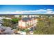 Aerial view of the hotel. The building is several stories tall and has parking on the front and side of the building at 3000 Maingate Ln # 205, Kissimmee, FL 34747