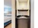 A convenient vanity area is situated just outside the main bathroom at 3000 Maingate Ln # 205, Kissimmee, FL 34747
