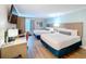 An interior view showing the bedroom, including beds, desk, and closet, with modern details at 3000 Maingate Ln # 205, Kissimmee, FL 34747