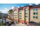 The beautiful hotel exterior with lush landscaping and manicured grounds at 3000 Maingate Ln # 205, Kissimmee, FL 34747