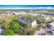 Corner aerial view of the Galleria building showing its parking lot and city around it at 3000 Maingate Ln # 424, Kissimmee, FL 34747