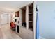 Well furnished bedroom with desk and chair, flatscreen tv, wardrobe with safe, and ironing board at 3000 Maingate Ln # 424, Kissimmee, FL 34747