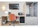 Bedroom features a desk with office chair, microwave, mini fridge, and wardrobe at 3000 Maingate Ln # 424, Kissimmee, FL 34747