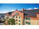 Beautiful view of the Galleria building under a clear blue sky with palm trees at 3000 Maingate Ln # 424, Kissimmee, FL 34747