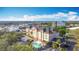 Beautiful exterior shot of a hotel with a pool at 3000 Maingate Ln # 424, Kissimmee, FL 34747