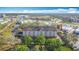 An aerial view showcases the multi-story hotel building and surrounding landscape at 3000 Maingate Ln # 424, Kissimmee, FL 34747