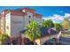 A daytime photo showing the hotel, signage, flag pole and parking area at 3000 Maingate Ln # 424, Kissimmee, FL 34747