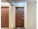 Hotel hallway featuring room doors and a decorative floral carpet at 3000 Maingate Ln # 424, Kissimmee, FL 34747