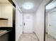 A bright hallway features tile flooring and a white door at 3000 Maingate Ln # 424, Kissimmee, FL 34747