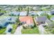 Features of this property include a red roof, mature landscaping, and a brick paver driveway at 318 Rock Springs Dr, Poinciana, FL 34759