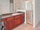 Bathroom sink with a shower featuring glass doors at 318 Rock Springs Dr, Poinciana, FL 34759