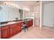 A bathroom features double sinks and a shower with glass doors at 318 Rock Springs Dr, Poinciana, FL 34759