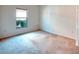 A carpeted bedroom features neutral walls with natural light at 318 Rock Springs Dr, Poinciana, FL 34759