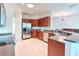 Bright kitchen boasts stainless steel appliances, tile floors, and plenty of cabinet space at 318 Rock Springs Dr, Poinciana, FL 34759