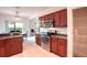 Kitchen features stainless steel appliances, breakfast bar, pantry, and view to dining area at 318 Rock Springs Dr, Poinciana, FL 34759