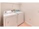 Laundry room with white washer and dryer at 318 Rock Springs Dr, Poinciana, FL 34759