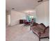 Spacious living area with neutral carpet, chandelier, and vintage furnishings offering comfort at 318 Rock Springs Dr, Poinciana, FL 34759