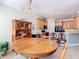 Bright breakfast nook next to the kitchen; the room has wood furniture and bar-height seating at 400 Indian Wells Ave, Poinciana, FL 34759