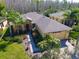 Beautiful single-story home with a well-manicured lawn, mature landscaping, and a brick walkway leading to the front door at 400 Indian Wells Ave, Poinciana, FL 34759