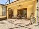 Spacious screened lanai features brick flooring, ceiling fan, and outdoor seating at 400 Indian Wells Ave, Poinciana, FL 34759