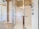 Shower boasts a frameless glass enclosure, grab bar, and upgraded multi-setting shower head at 400 Indian Wells Ave, Poinciana, FL 34759
