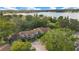 Aerial view of the property showcases the surrounding mature trees and the lake in the background at 406 Oak Haven Dr # 406, Altamonte Springs, FL 32701
