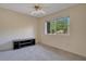 Cozy bedroom with neutral carpet, ceiling fan, and a window offering natural light at 406 Oak Haven Dr # 406, Altamonte Springs, FL 32701