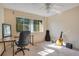 Spacious bedroom featuring a ceiling fan, a desk and chair set, and a window at 406 Oak Haven Dr # 406, Altamonte Springs, FL 32701