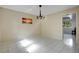 Bright dining room featuring ceramic tile floors, a hanging chandelier, neutral paint and lots of natural light at 406 Oak Haven Dr # 406, Altamonte Springs, FL 32701