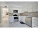 Efficient kitchen with white cabinetry, stainless steel appliances, and tiled backsplash at 406 Oak Haven Dr # 406, Altamonte Springs, FL 32701
