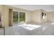 Living room featuring ceramic tile flooring, sliding glass doors and neutral paint and lots of natural light at 406 Oak Haven Dr # 406, Altamonte Springs, FL 32701