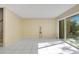 Bright living room featuring ceramic tile floors, sliding glass doors with lots of natural light, and neutral paint at 406 Oak Haven Dr # 406, Altamonte Springs, FL 32701
