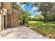 Spacious backyard with a concrete patio, adjacent to green space and mature trees at 406 Oak Haven Dr # 406, Altamonte Springs, FL 32701