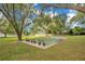 A community shuffleboard court ready for play, with benches and mature trees nearby at 406 Oak Haven Dr # 406, Altamonte Springs, FL 32701