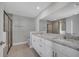 Bathroom features double sink granite vanity and a separate glass door shower at 41 Peterlee Ct, Kissimmee, FL 34758