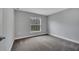 Bedroom offers a serene atmosphere with soft carpet and a view of the outdoors at 41 Peterlee Ct, Kissimmee, FL 34758