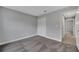A cozy bedroom featuring neutral gray walls and plush carpeting, complemented by a closet and bright, white trim at 41 Peterlee Ct, Kissimmee, FL 34758
