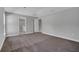 Bedroom with plush carpet, neutral walls, and easy access to the bathroom at 41 Peterlee Ct, Kissimmee, FL 34758