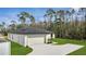 A cozy home with a two-car garage and well-maintained landscaping at 41 Peterlee Ct, Kissimmee, FL 34758