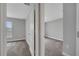 The hallway leads to two carpeted bedrooms, featuring neutral gray walls and white doors at 41 Peterlee Ct, Kissimmee, FL 34758